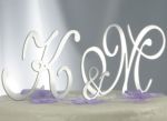 Three letter brushed metal monogram cake topper.